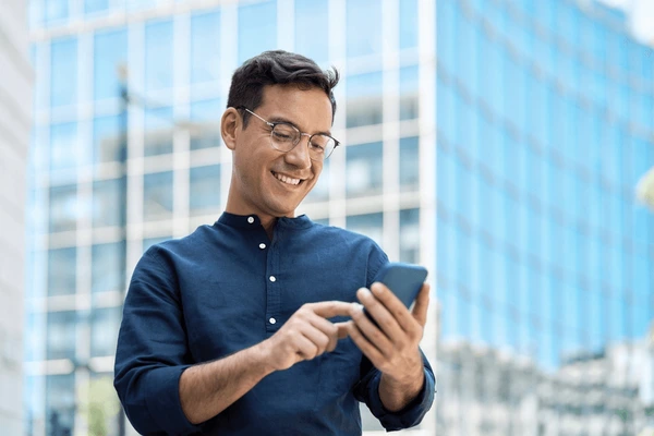 happy young hispanic business man 600nw 2575711931